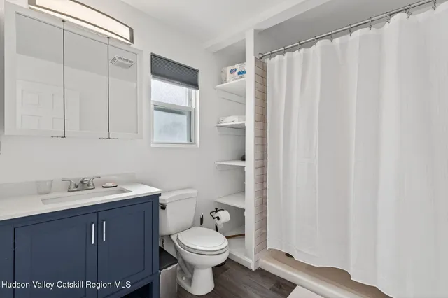 a view of a swimming pool with a patio and yard