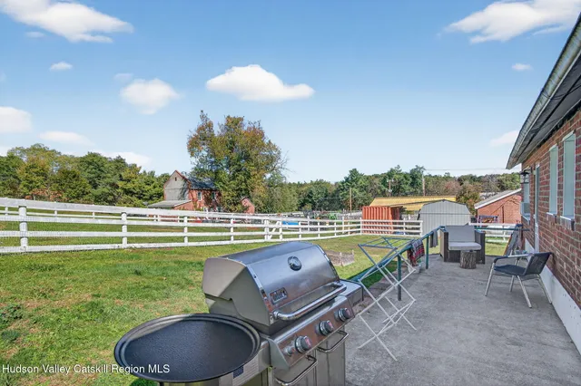 a view of road with houses and car parked