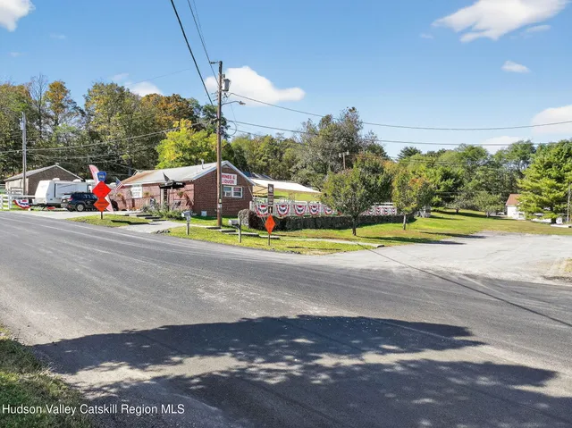 an aerial view of a pool patio yard and outdoor seating