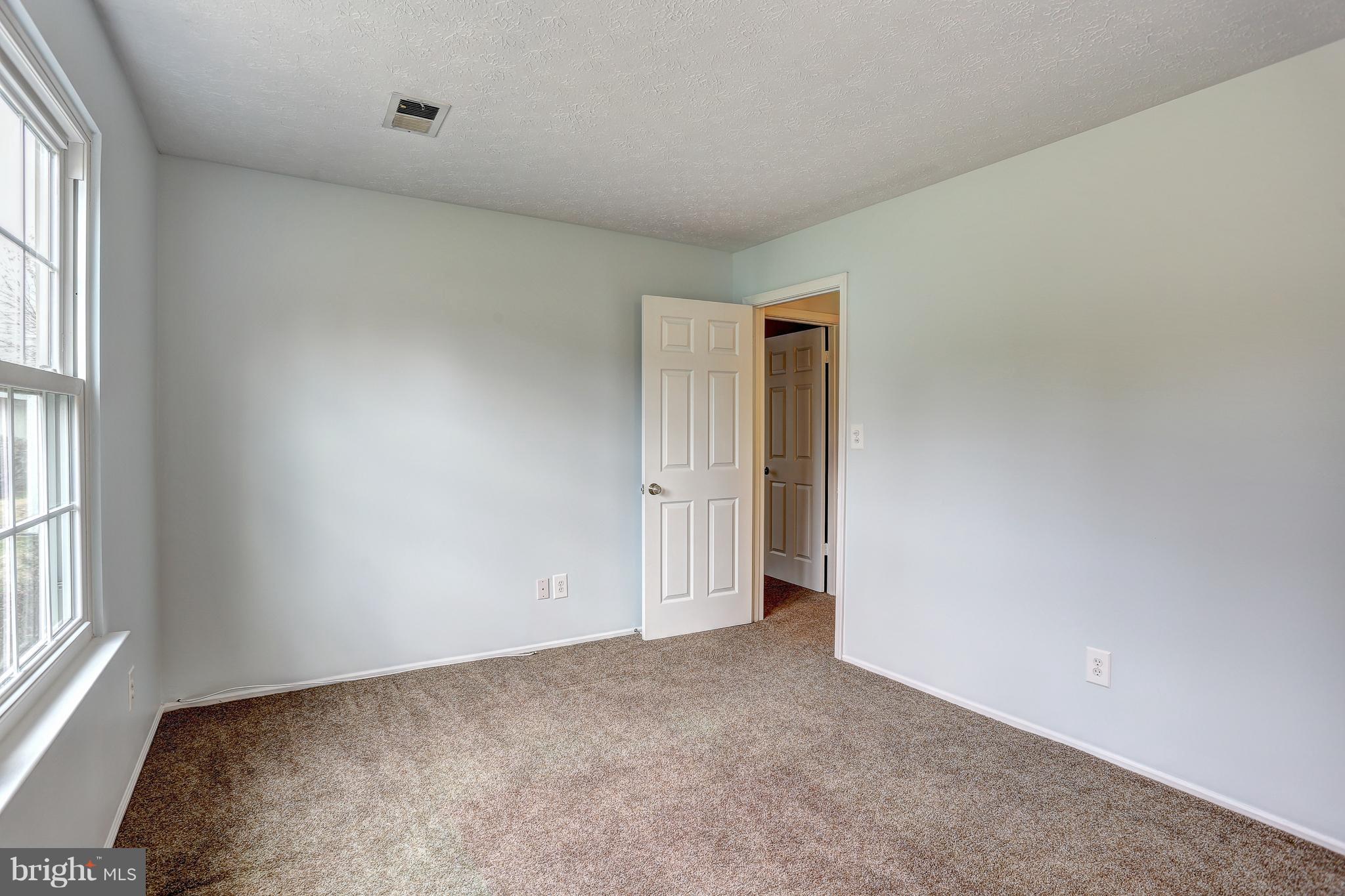 553 Harvest Road Severn, MD 21144 - Photo 22 of 38 an empty room with windows