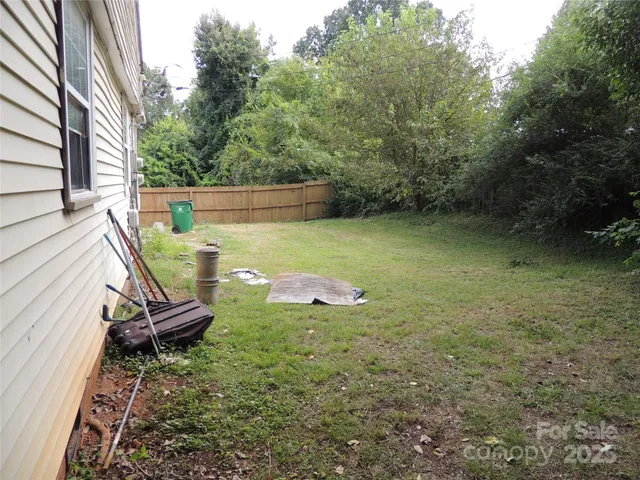 a view of a two chairs in the patio