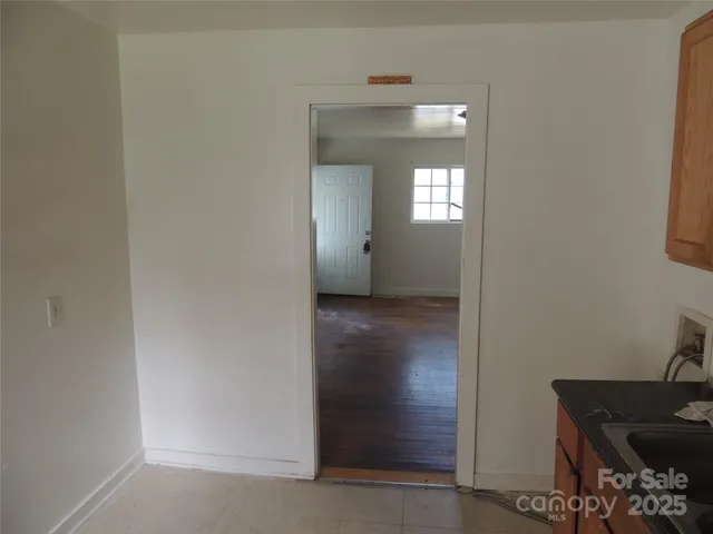 a view of a livingroom from a hallway