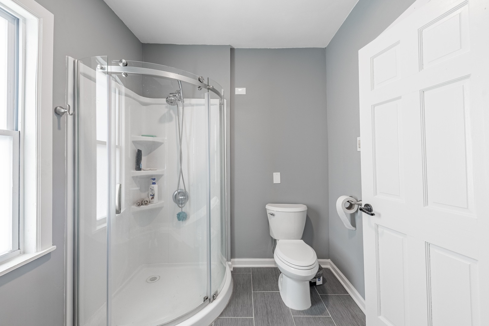 7629 South Green Street Chicago, IL 60620 - Photo 25 of 53 a bathroom with a shower and a toilet