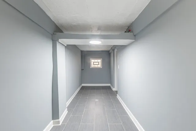 a bathroom with a granite countertop sink toilet and a mirror