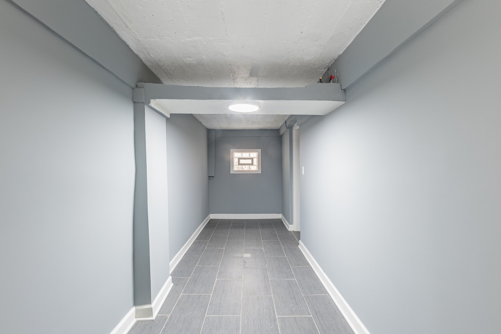 7629 South Green Street Chicago, IL 60620 - Photo 42 of 53 a view of hallway with window
