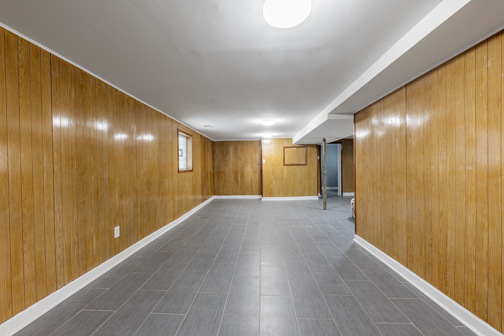 7629 South Green Street Chicago, IL 60620 - Photo 49 of 53 a view of an empty room with wooden floor