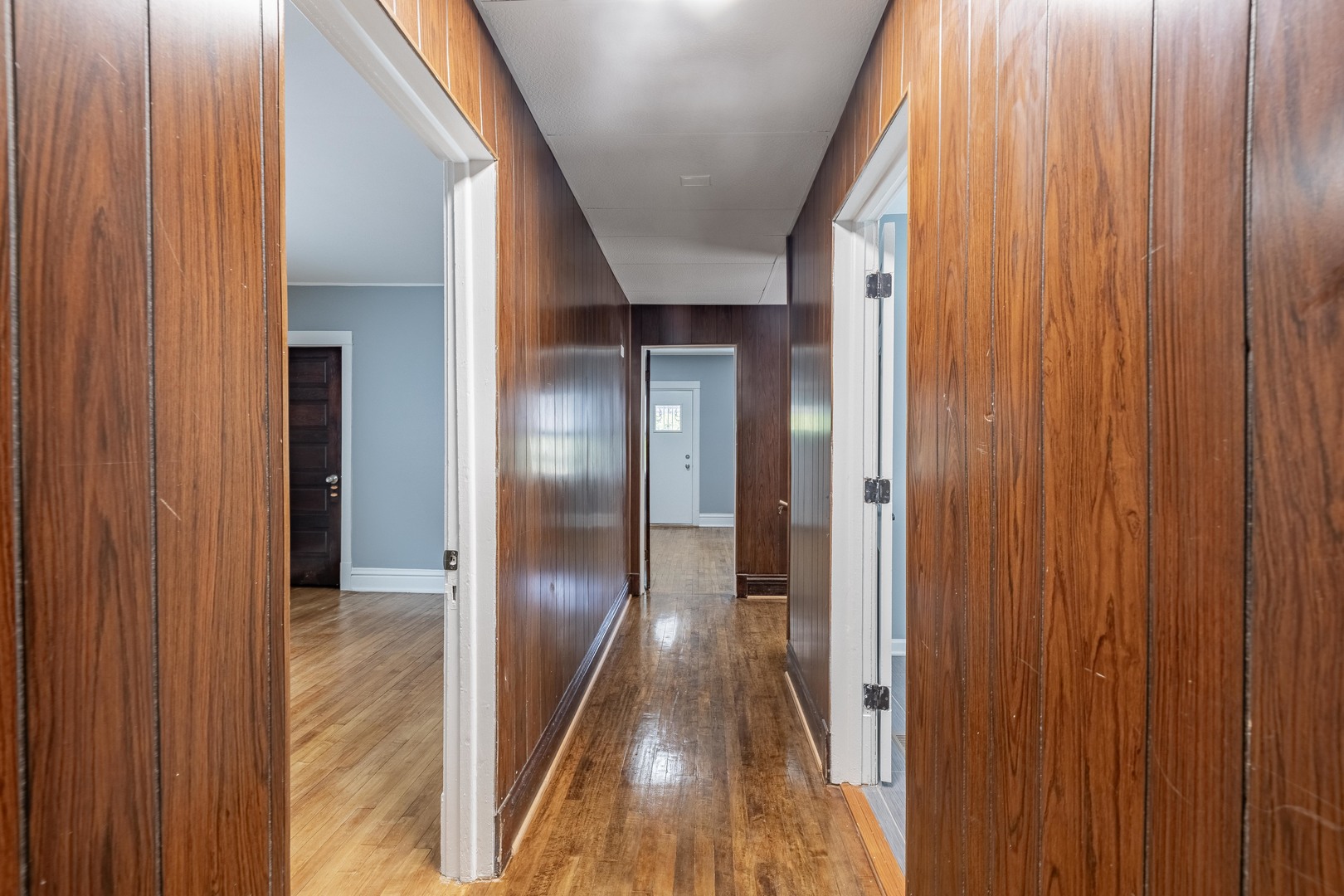 7629 South Green Street Chicago, IL 60620 - Photo 5 of 53 a view of hallway with wooden floor