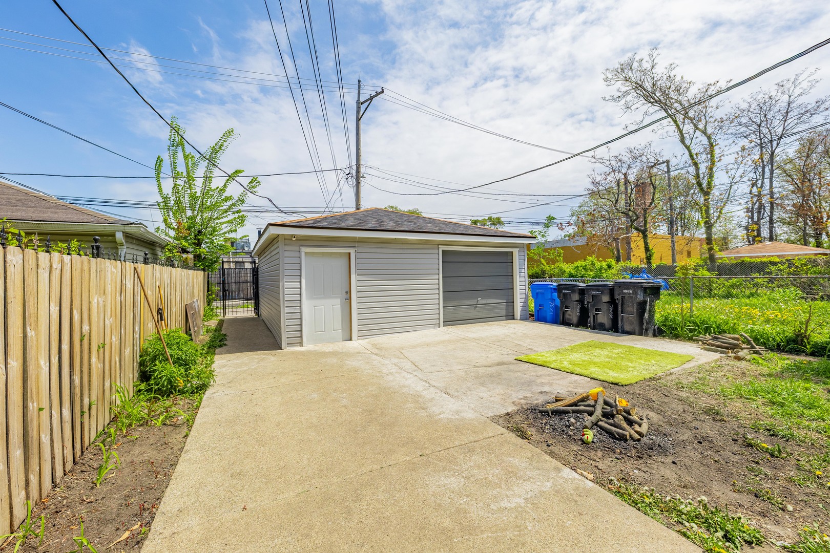 7629 South Green Street Chicago, IL 60620 - Photo 52 of 53 a front view of a house with a yard and garage
