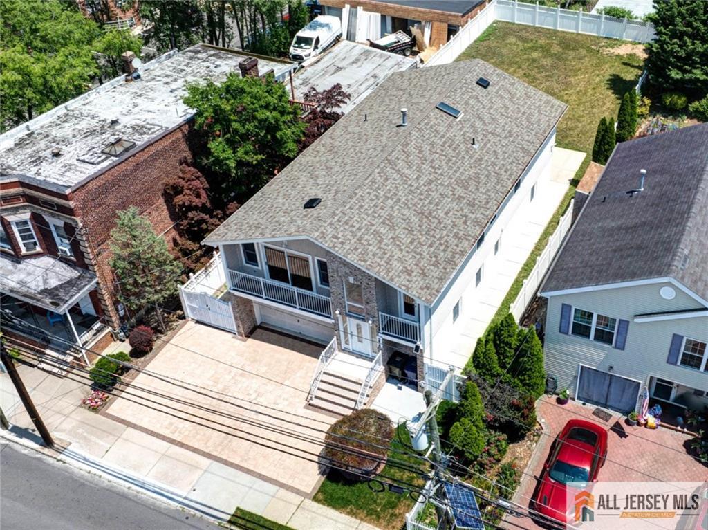 278 Rector Street Perth Amboy, NJ 08861 - Photo 1 of 47 an aerial view of a house with a yard and potted plants