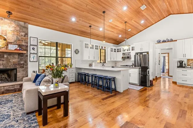 a kitchen with stainless steel appliances a sink a stove and a refrigerator