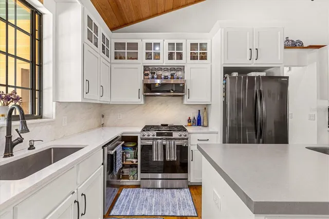 a bed room with furniture and a flat screen tv
