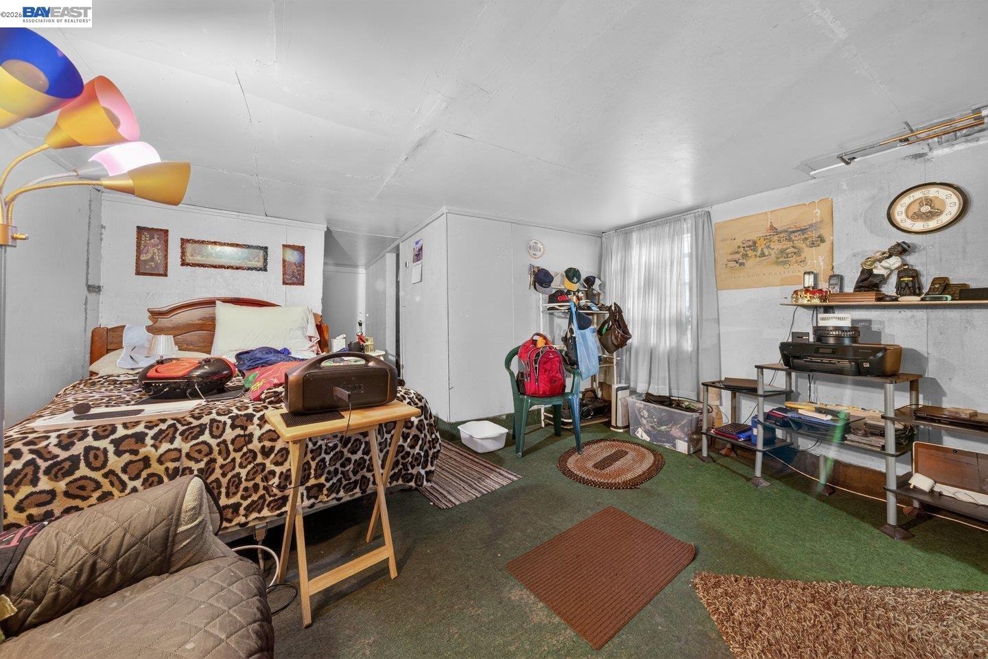 940 Delaware Street Berkeley, CA 94710 - Photo 11 of 16 a bedroom with furniture and a rug