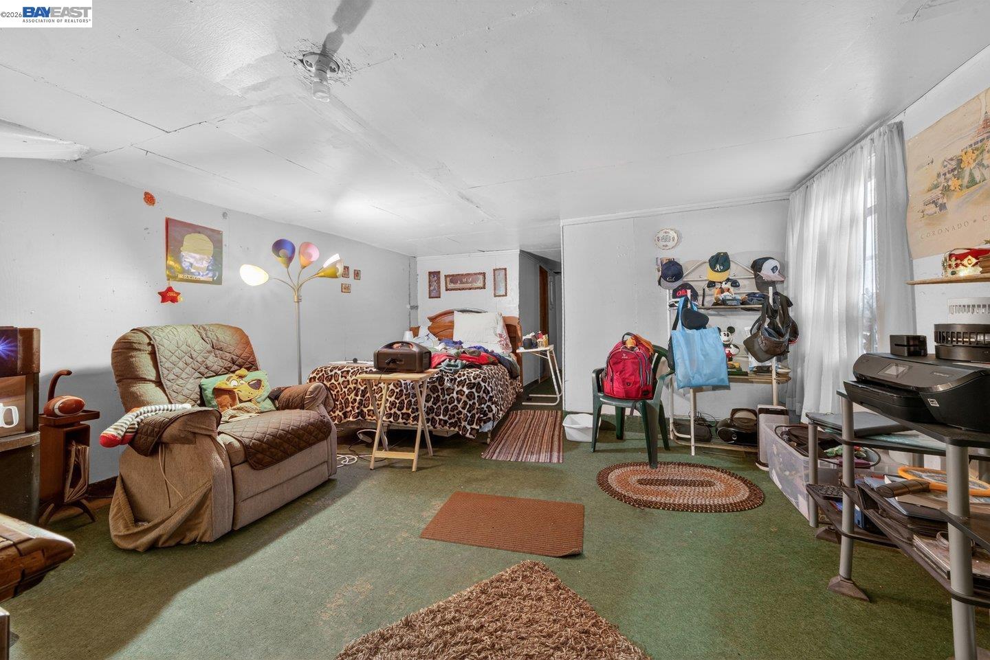 940 Delaware Street Berkeley, CA 94710 - Photo 13 of 16 a living room with furniture a couch and a window