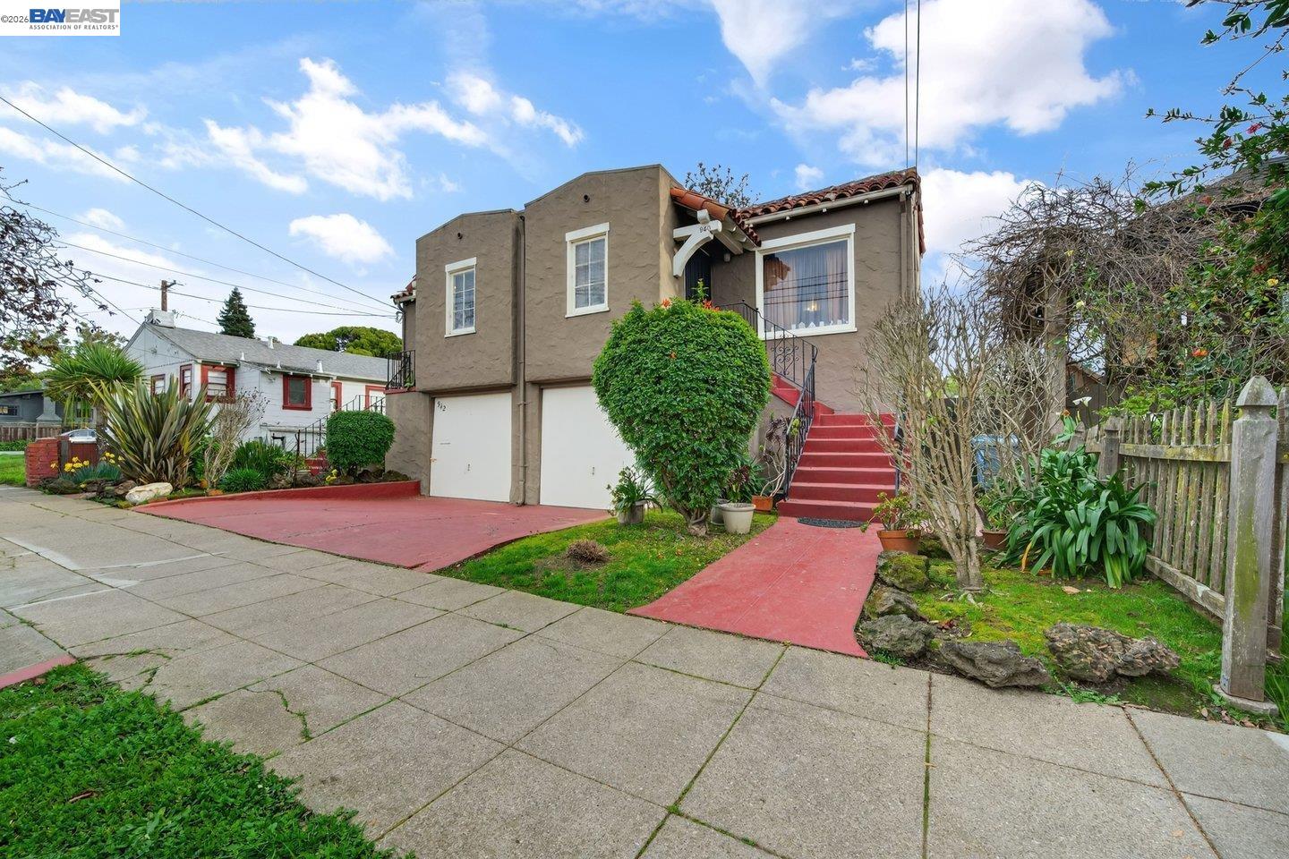 940 Delaware Street Berkeley, CA 94710 - Photo 2 of 16 a front view of a house with a yard and potted plants