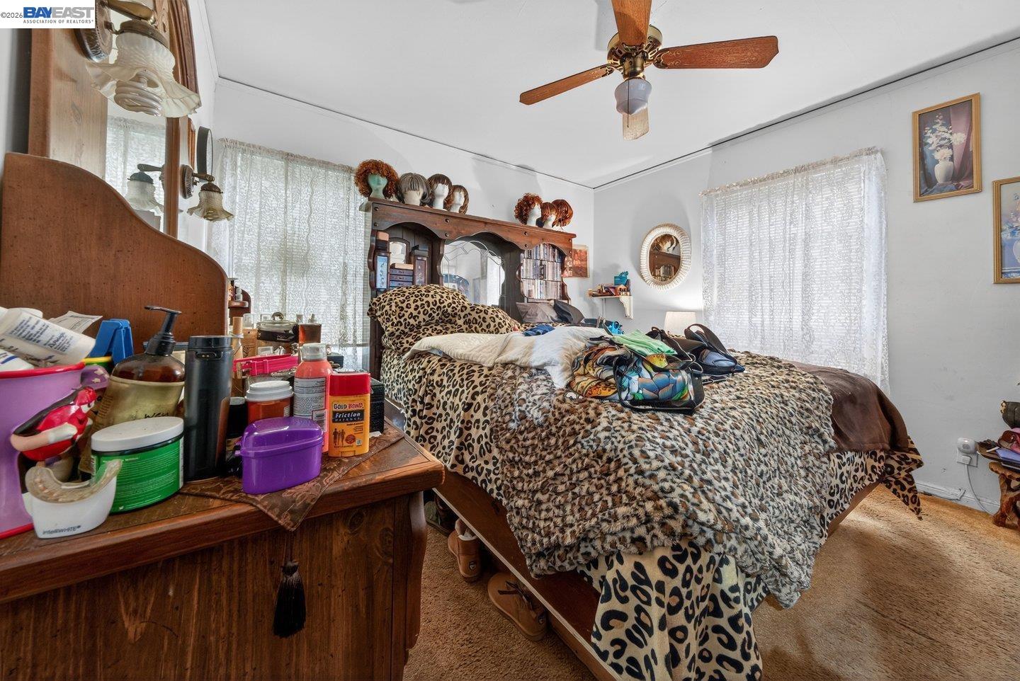 940 Delaware Street Berkeley, CA 94710 - Photo 9 of 16 a bed room with a bed mirror and a window