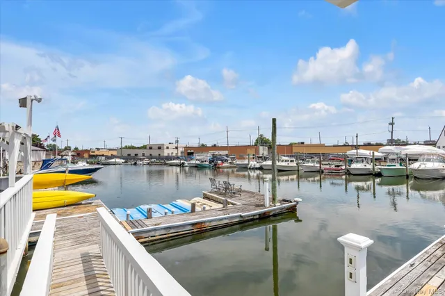a view of a lake with boats and trees in the background