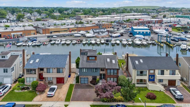 a aerial view of multiple houses with a lake view