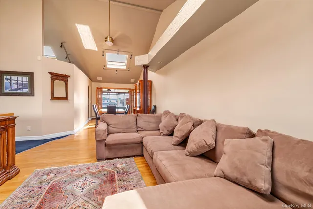 a living room with furniture and a rug