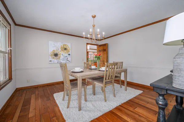 a kitchen with granite countertop a sink and cabinets