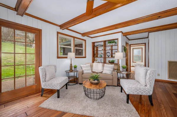 a view of a dining room with furniture window and outside view