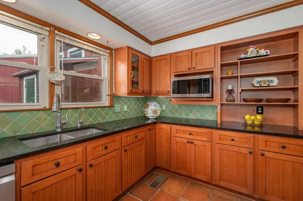 a utility room with sink dryer and washer