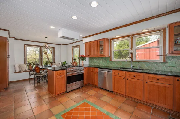 a bathroom with a sink mirror and toilet