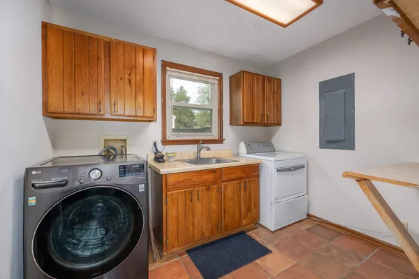 a bathroom with 2 sink and a mirror
