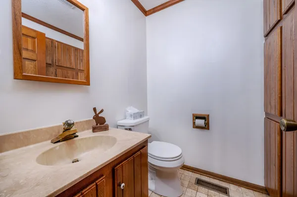 a spacious bathroom with a double vanity sink and a mirror