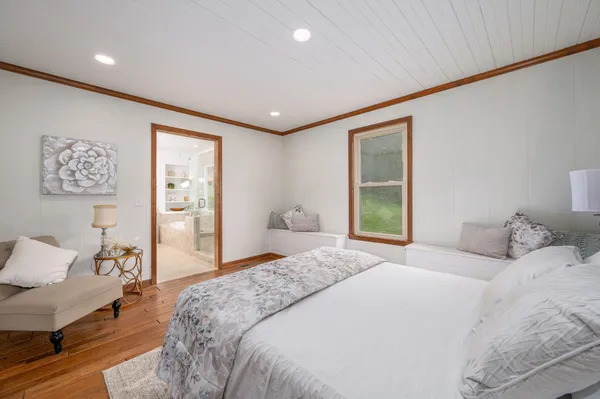 a workspace room with furniture and windows