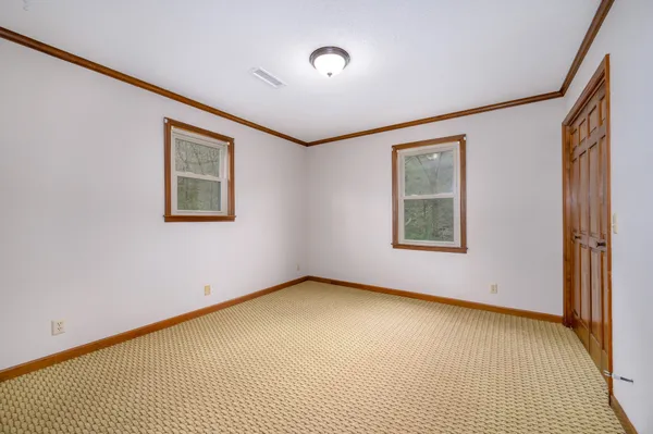 a view of a garage with wooden floor