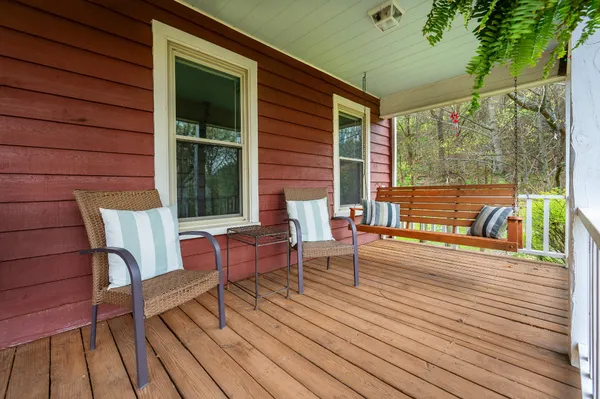 a view of a livingroom with furniture and a window