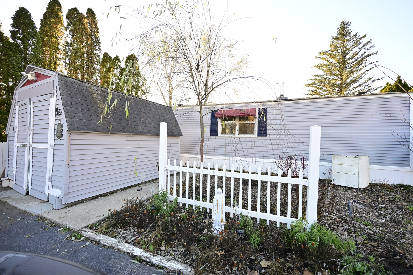 50 Beacon Bay Road Lakemoor, IL 60051 - Photo 1 of 1 a view of a house with a small yard and wooden fence