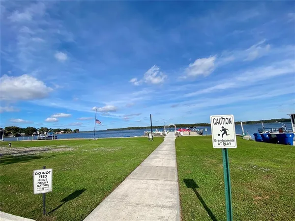 a view of a street with a yard in back