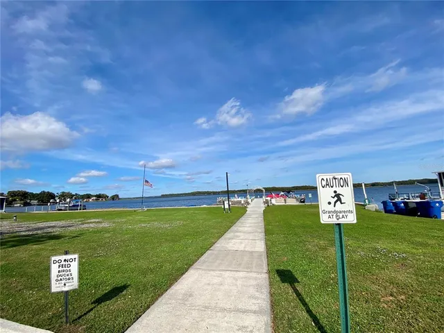 a view of a street with a yard in back