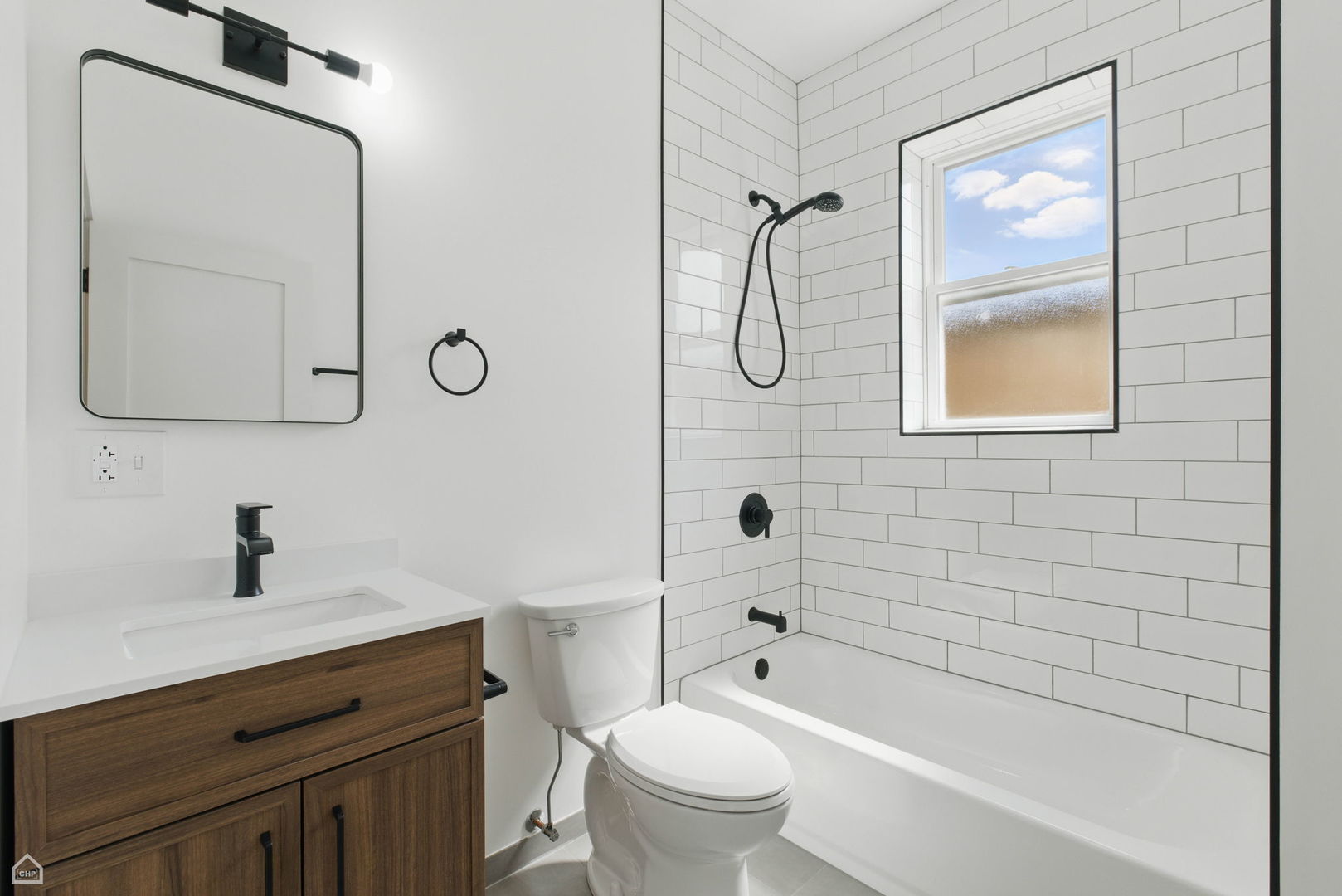 1928 West 21st Street, Unit 2F Chicago, IL 60608 - Photo 8 of 16 a bathroom with a toilet sink and mirror