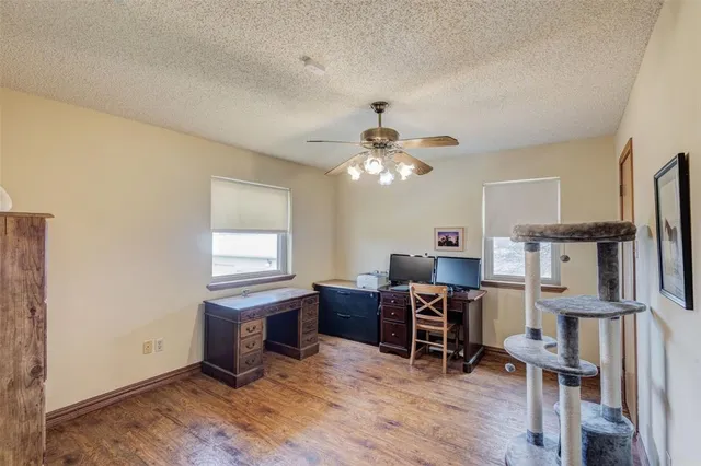 a view of a workspace with furniture and a kitchen