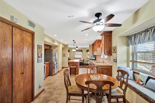 a view of a dining room with furniture window and outside view