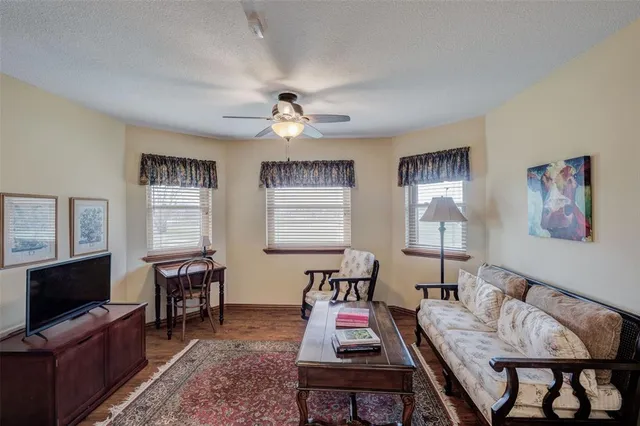 a view of a livingroom with furniture and a flat screen tv