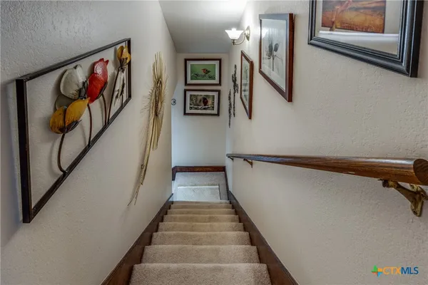 a view of hallway with stairs