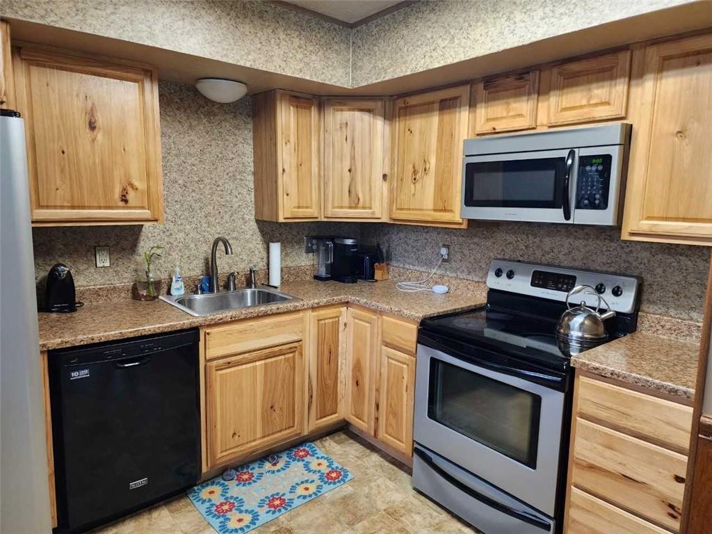 154 Bend Road New Wilmington, PA 16142 - Photo 3 of 22 a kitchen with stainless steel appliances granite countertop a stove a sink and a microwave