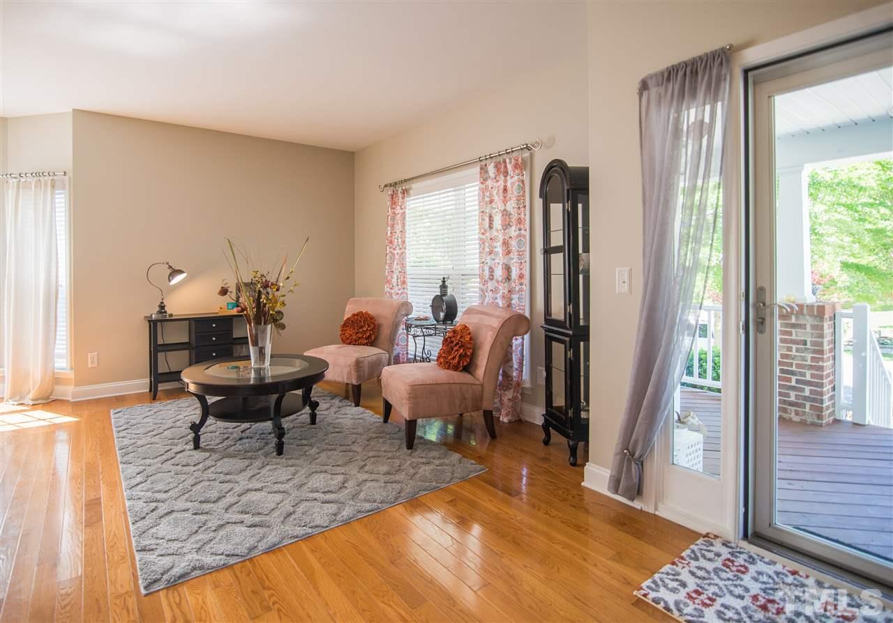 10715 Friendly Neighbor Lane Raleigh, NC 27614 - Photo 2 of 25 Cozy sitting room as you enter your home. Perfect place to curl up with a good book!