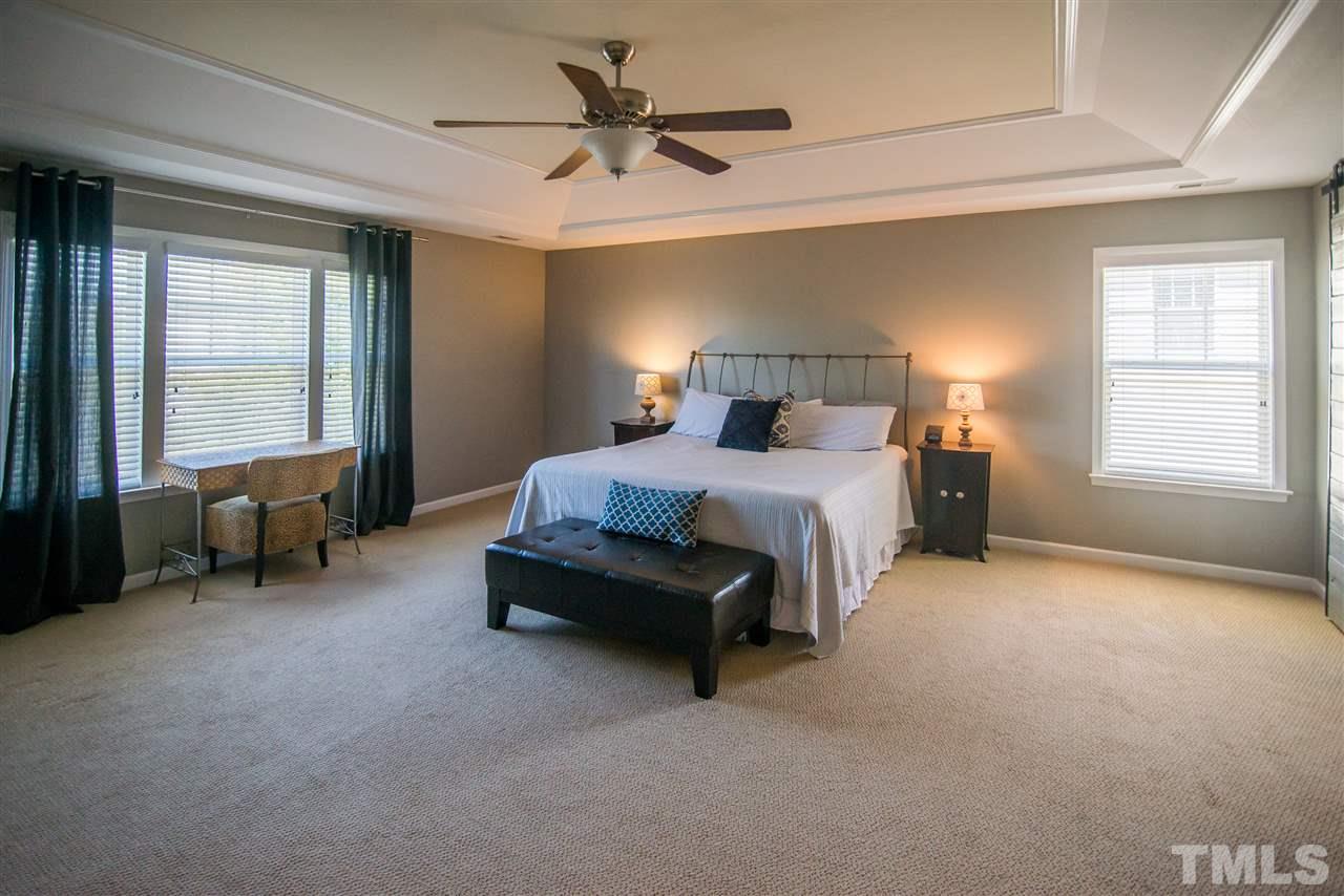 10715 Friendly Neighbor Lane Raleigh, NC 27614 - Photo 12 of 25 Spacious master retreat with several windows for plenty of light. Look at those trey ceilings!
