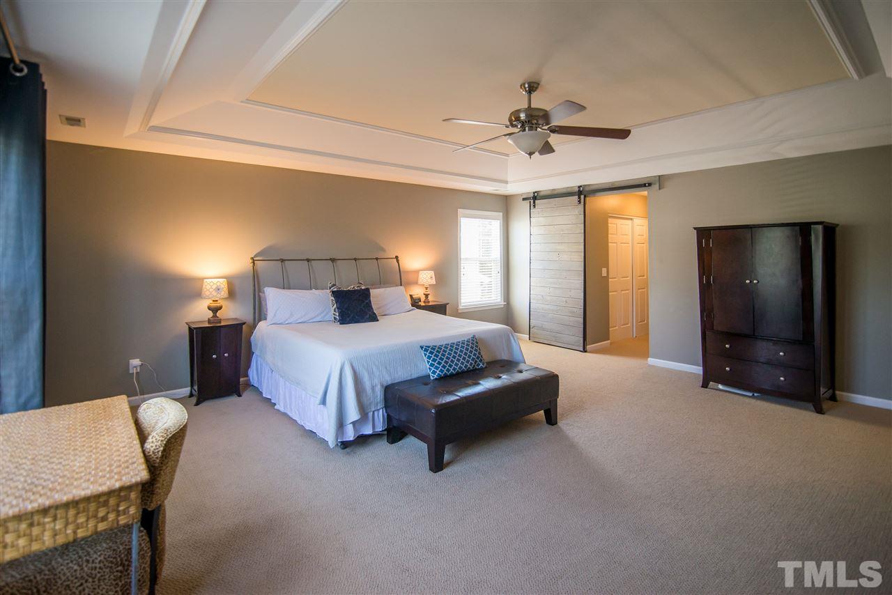 10715 Friendly Neighbor Lane Raleigh, NC 27614 - Photo 13 of 25 So much space and custom made sliding barn door!!!