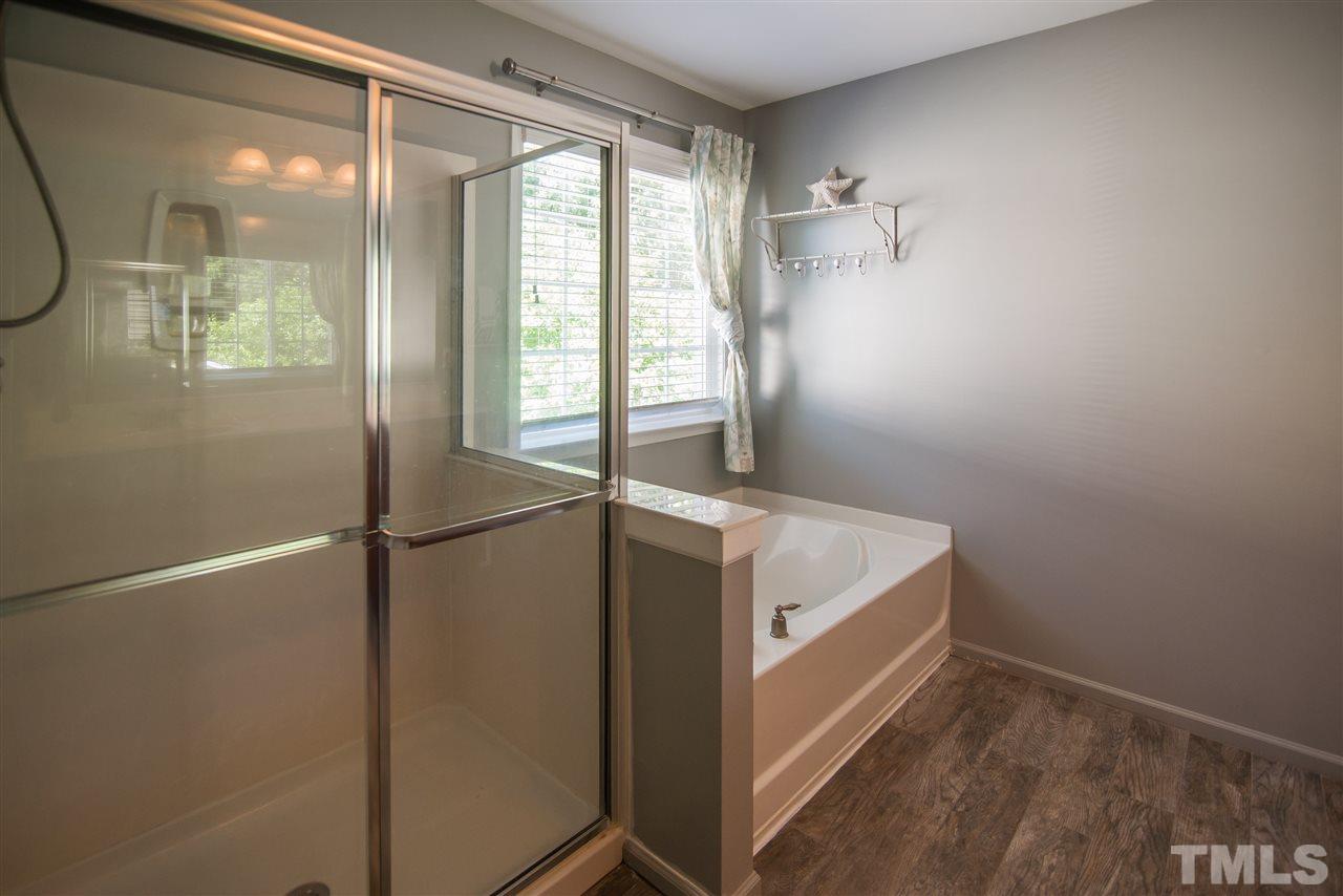10715 Friendly Neighbor Lane Raleigh, NC 27614 - Photo 15 of 25 Separate shower with garden tub.
