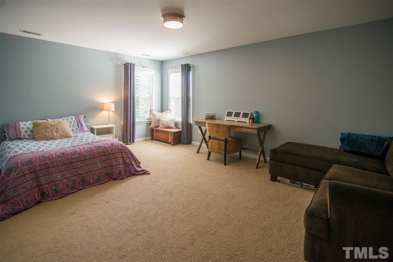 10715 Friendly Neighbor Lane Raleigh, NC 27614 - Photo 18 of 25 Large bedroom that could also be a bonus room-you choose! It's the perfect hangout spot for the kids!