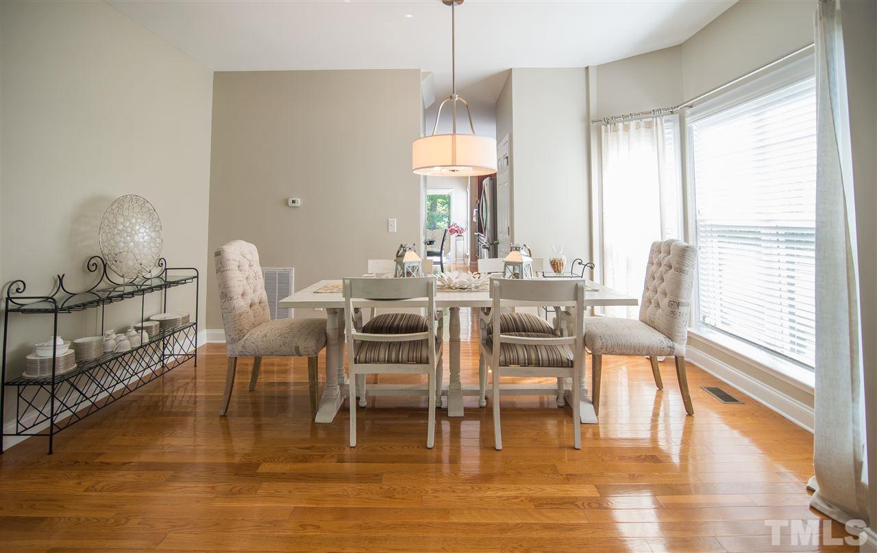 10715 Friendly Neighbor Lane Raleigh, NC 27614 - Photo 3 of 25 Holiday family meals are sure to be remembered in this nice size dining area with beautiful bay window!