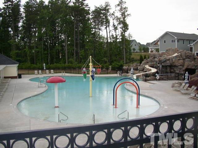10715 Friendly Neighbor Lane Raleigh, NC 27614 - Photo 24 of 25 Bedford boasts the BEST kid pool around! No matter your age, you'll love the showering arches and super fun water slide!
