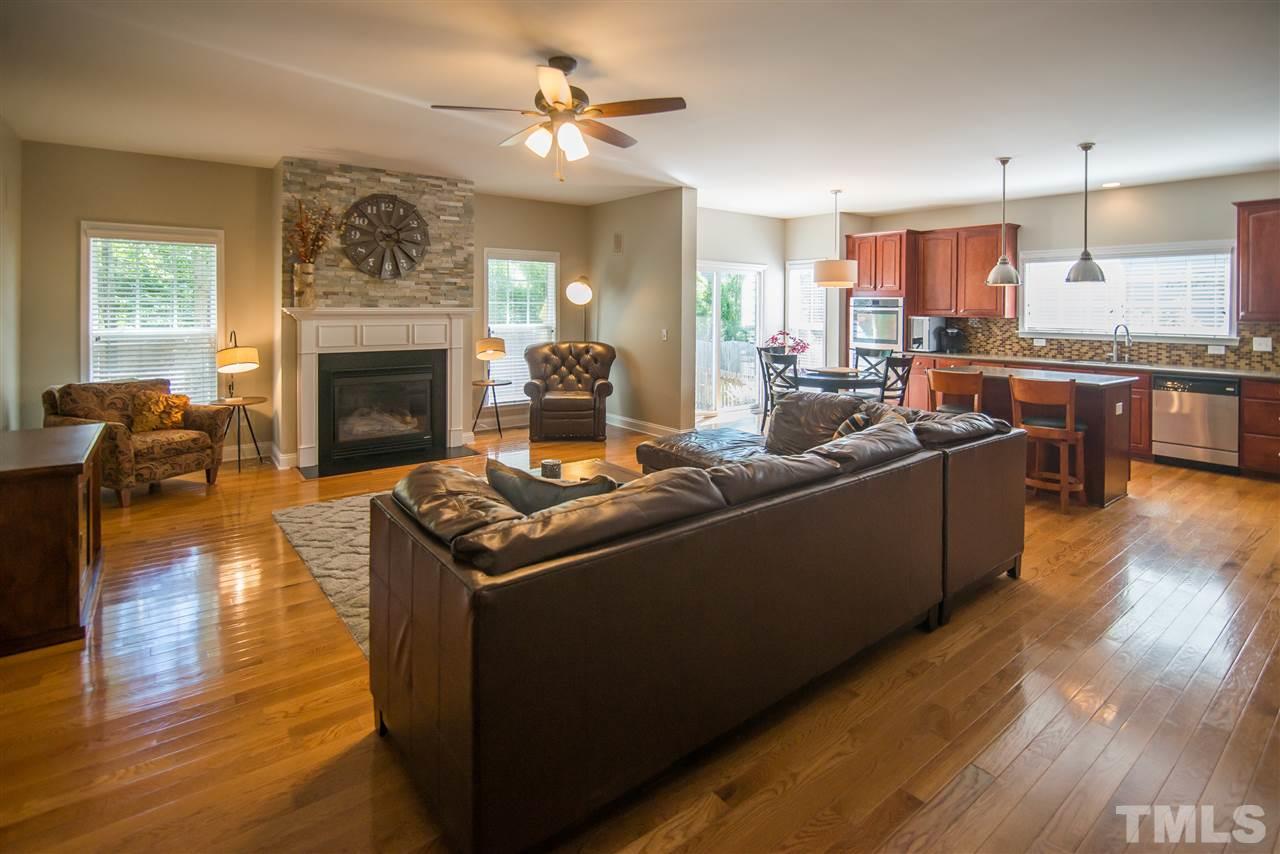 10715 Friendly Neighbor Lane Raleigh, NC 27614 - Photo 10 of 25 Nice size family room just off from the kitchen. Features gorgeous stone gas fireplace!
