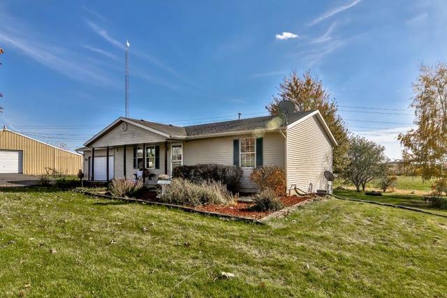 5901 Rotary Road Cherry Valley, IL 61016 - Photo 1 of 19 a view of a house with a yard