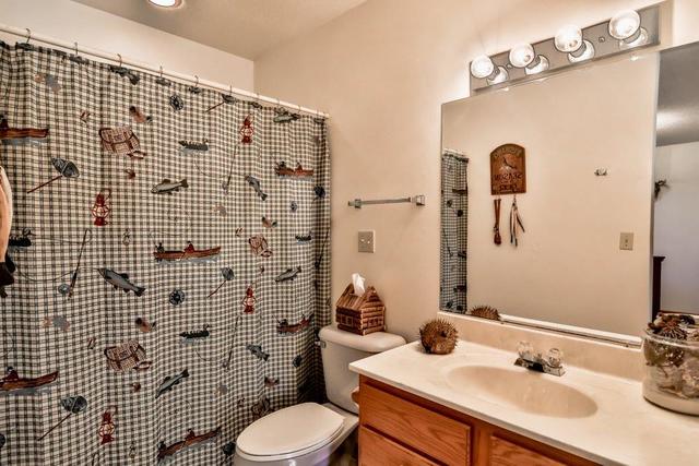 5901 Rotary Road Cherry Valley, IL 61016 - Photo 13 of 19 a bathroom with a sink toilet and shower